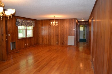 Hardwood through the kitchen/dinning room into the hallway.
