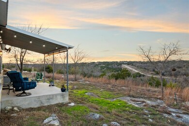 Yard at dusk featuring a patio