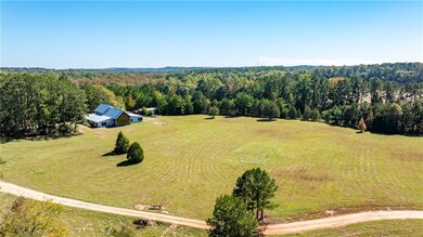 Birds eye view of property with a rural view