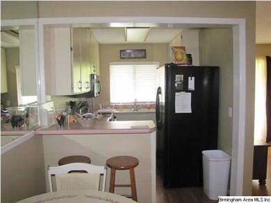 Nice size kitchen with breakfast bar and adjoining