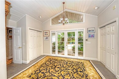 Volume ceiling make this entryway grand opening to