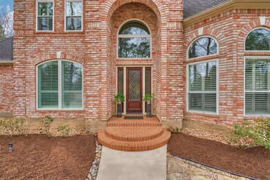 Grand two-story covered entry on this impeccably maintained custom!