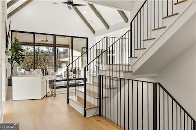 Open staircase to go upstairs and down to the terrace level.
