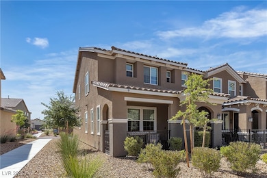 View of front of property with stucco siding, a ti