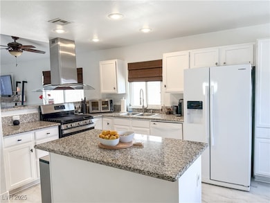 Kitchen with a sink, extractor fan, marble finish