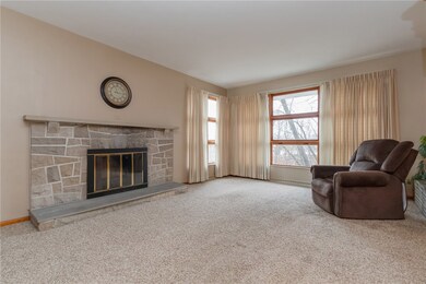 HUGE living room, wood stone fireplace, large wind