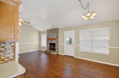 Unfurnished living room with vaulted ceiling, dar
