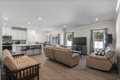 Living room with an inviting chandelier, light har