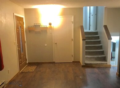 Front entry and stairs to upper level