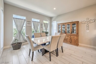 Dining area with baseboards and recessed lighting