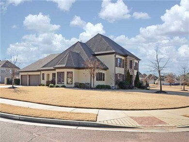 Home is situated on level corner lot with side loa
