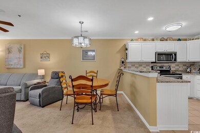 Dining area with a ceiling fan, recessed lighting, crown molding, light tile patterned floors, and baseboards