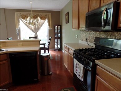 View from kitchen to dining area. Solid wood floor