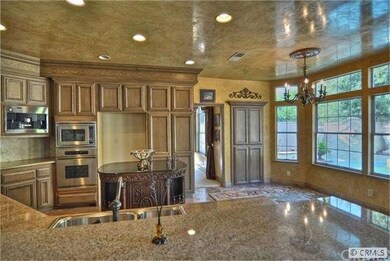 Remodeled kitchen with granite, custom cabinet fin