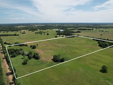 Birds eye view of property featuring a rural view