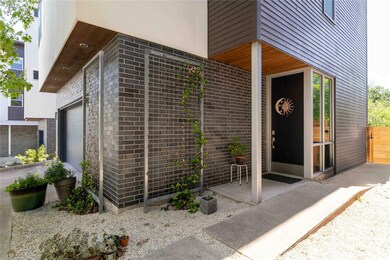 Property entrance featuring an attached garage an