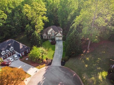 Aerial view featuring a view of trees