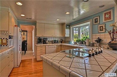 Hard Wood Floors , Tile Counters & Walk In Pantry