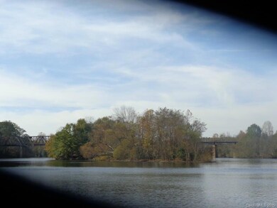 After Duke State Park by boat there are a few islands so go slow. Pass the tresle overpass then you reach the site on the right side after Statesville Brick. Part of our land includes an island similar to this one.
