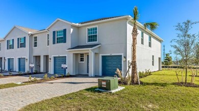 View of front facade with a garage and a front yar