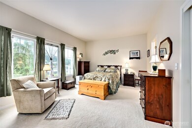 Primary bedroom with a water view.