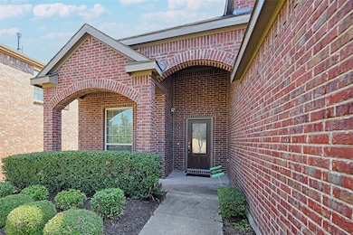 Property entrance with brick siding