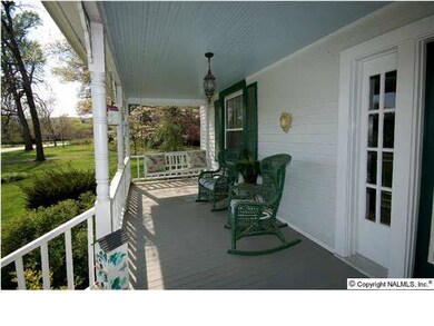 Relax on the delightful front porch with a glass of cold sweet tea and watch the world go by.