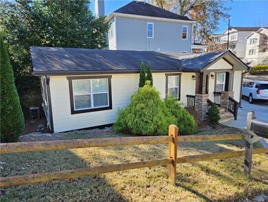 Traditional-style house with fence, a shingled roo
