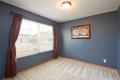 Large front window in den off the entry way.