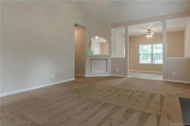 Large living room with tiled formal dining room