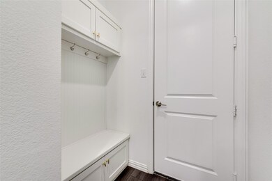 Mudroom featuring dark wood-type flooring