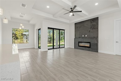 Unfurnished living room featuring healthy amount o