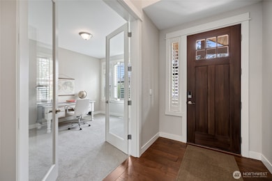 Upgraded Wood Front Door, Glass French Doors to Office and 8' Tall Interior Doors throughout Main floor