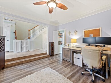Spacious formal dining area is used by the current owner as their office.