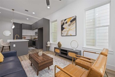 This open floor plan (living, dining, and kitchen)