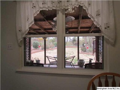 View from kitchen of deck & yard