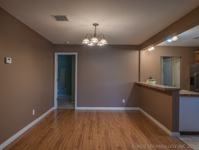 The dining room is open to the kitchen and living
