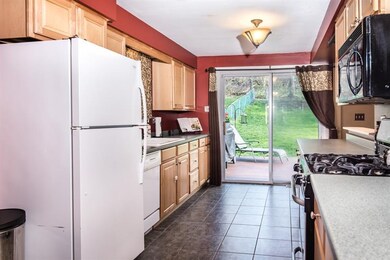 Kitchen has ceramic tile flooring.