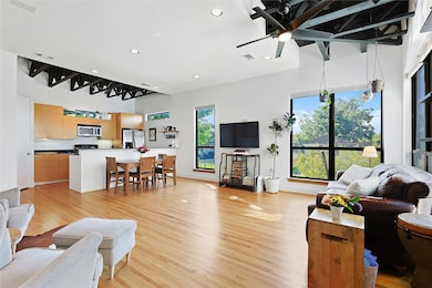 Sun-drenched second-floor living room with seamless open-concept design