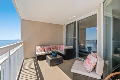 Balcony featuring a water view and outdoor lounge 