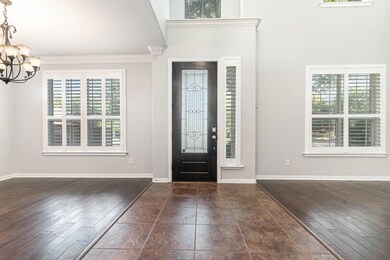 Entryway with ornamental molding, dark hardwood / 
