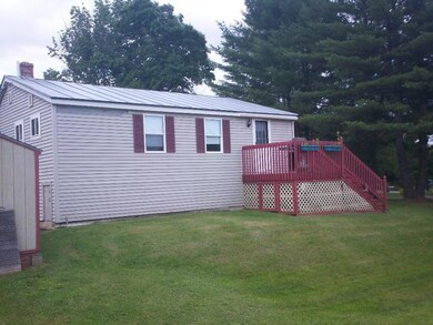 Rear Exterior showing deck and yard
