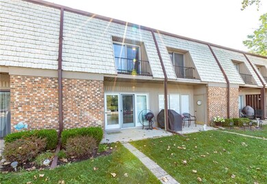 Water side of condo with French door ent