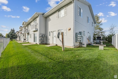 Back of property featuring a fenced backyard and a residential view