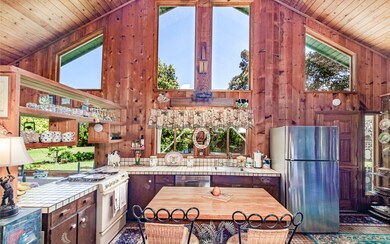 Views to the tree tops from gable windows.  Seasonally, Magnolia and Lehua Ohia blossoms are visible.