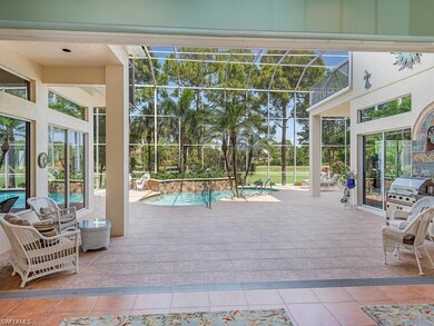 Expansive Lanai with Stunning Golf Course and Lake View and Outdoor Grilling Kitchen