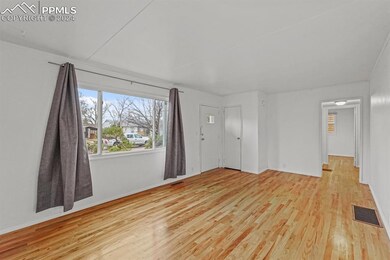 Spare room featuring light hardwood / wood-style f