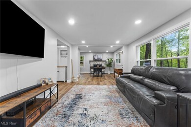 Living room with neutral walls and wood like LVP flooring