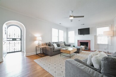 Spacious living room with decorative fireplace and