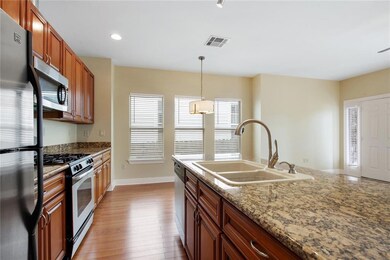 Kitchen with granite counter tops, SS appliances